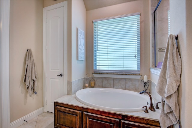 bathroom with tile patterned flooring and a bathtub