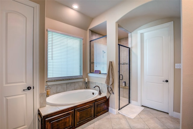 bathroom featuring separate shower and tub and tile patterned floors