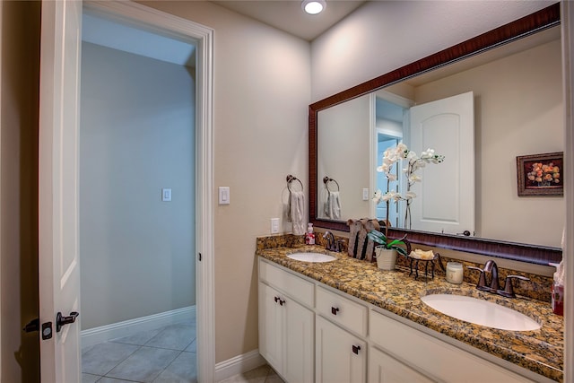 bathroom with tile patterned flooring and vanity