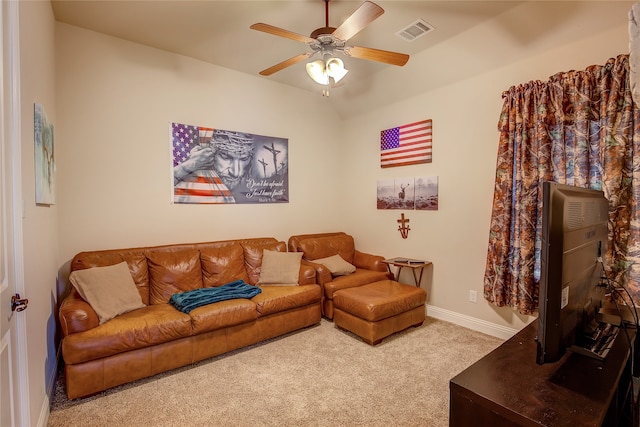 carpeted living room featuring ceiling fan