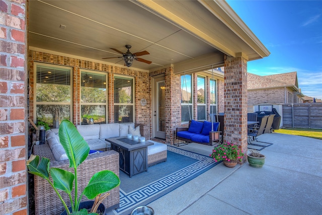 view of patio with an outdoor living space and ceiling fan