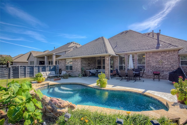 view of swimming pool featuring an outdoor living space and a patio