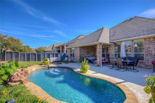 view of pool featuring outdoor lounge area and a patio area