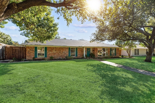 ranch-style house with a front yard