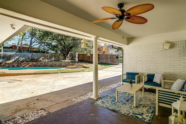 view of patio / terrace featuring ceiling fan and an outdoor living space