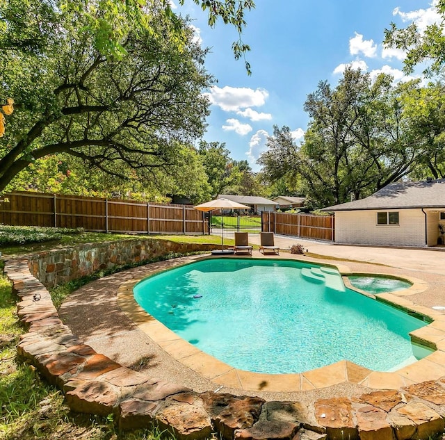 view of swimming pool featuring a patio area