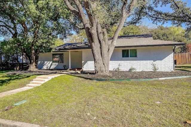 ranch-style house with a front yard