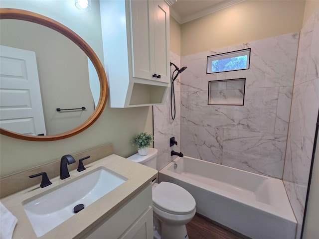 bathroom featuring toilet, wood finished floors, vanity, washtub / shower combination, and crown molding