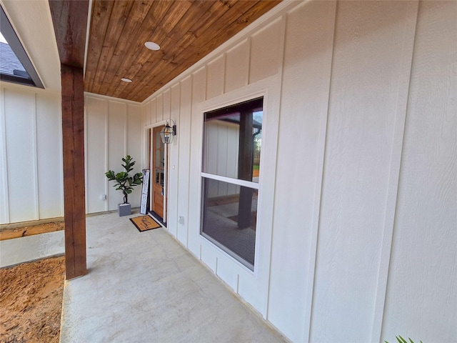 view of exterior entry featuring board and batten siding