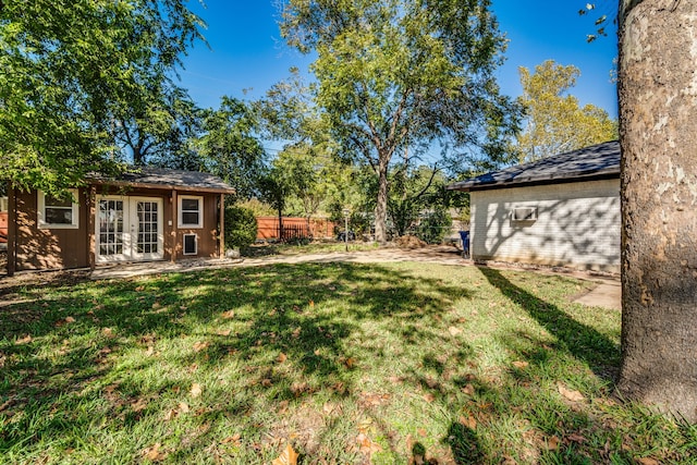 view of yard with french doors