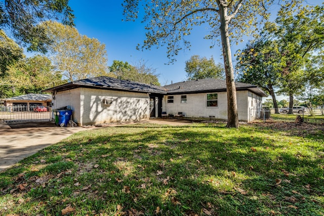 back of property featuring a yard and a patio area