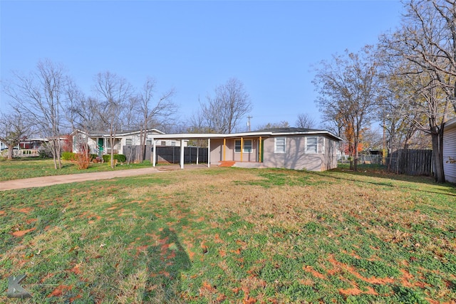 single story home featuring a front yard and a carport