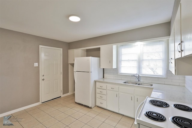 kitchen with white appliances, light tile patterned floors, decorative backsplash, white cabinets, and sink