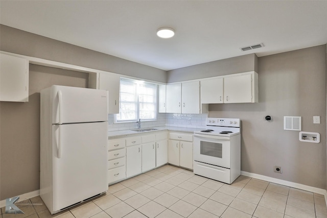 kitchen featuring white appliances, tasteful backsplash, white cabinets, light tile patterned flooring, and sink