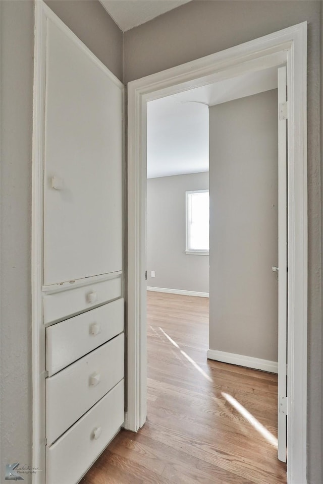 hallway featuring light hardwood / wood-style flooring