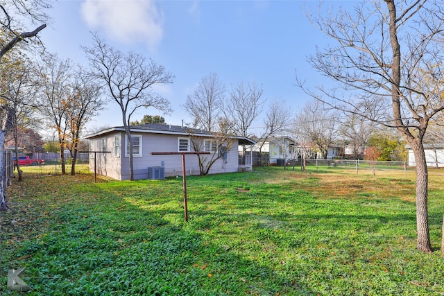 view of yard with central AC unit