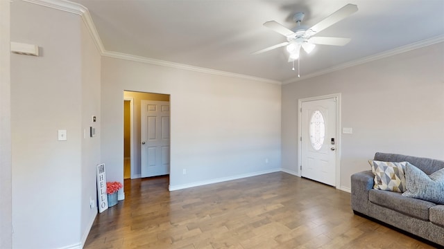 entrance foyer featuring wood-type flooring, ceiling fan, and crown molding