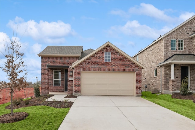 front facade featuring a garage and a front yard