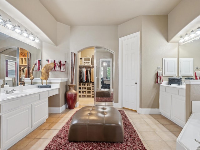 bathroom featuring tile patterned flooring and vanity