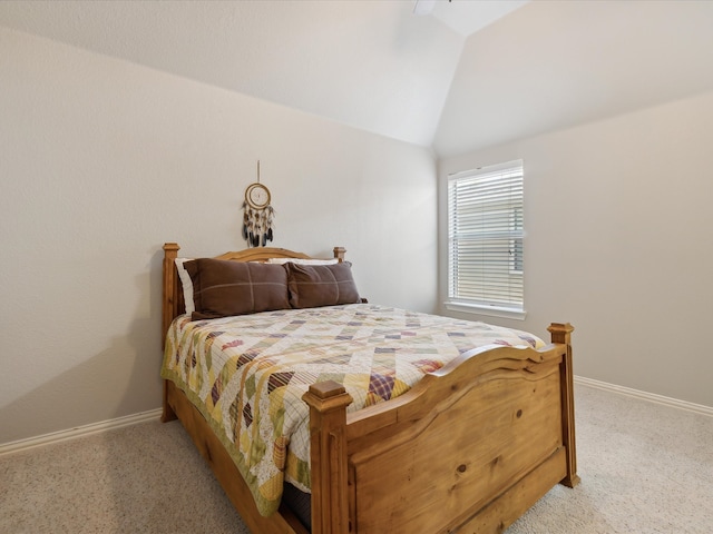 carpeted bedroom with lofted ceiling