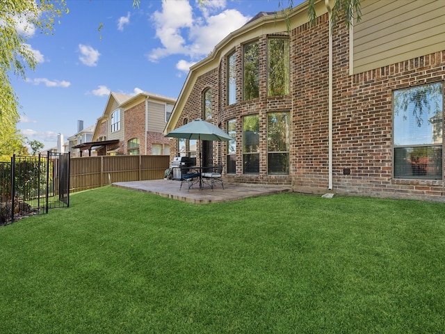 back of house featuring a yard and a patio area