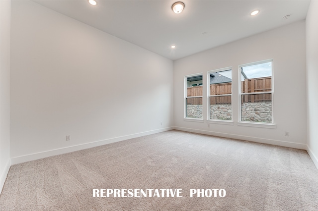 spare room featuring carpet flooring