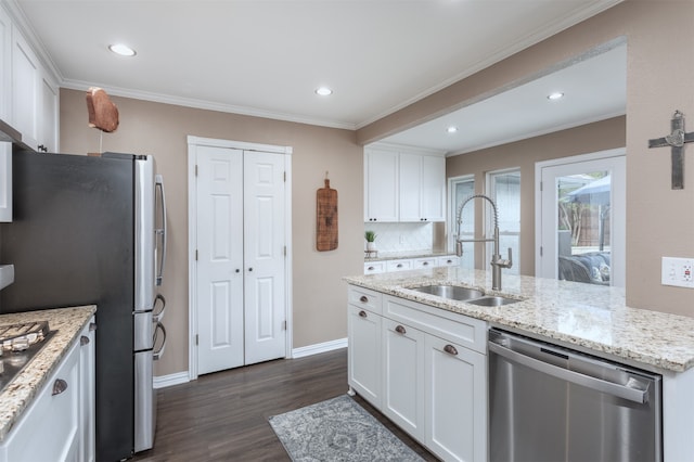 kitchen with white cabinetry, sink, and stainless steel appliances