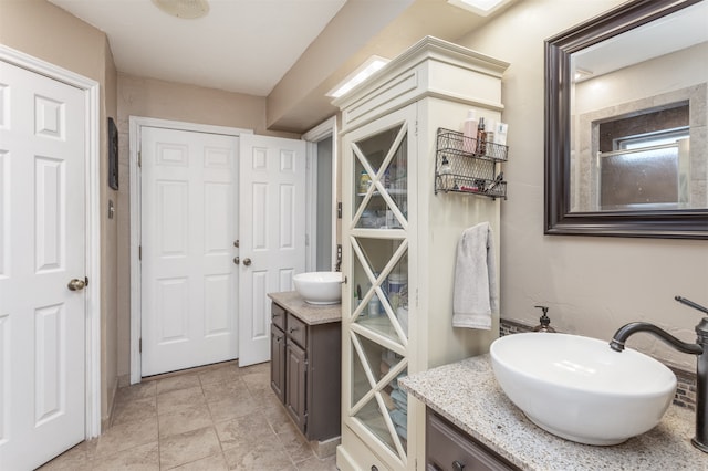 bathroom with vanity and tile patterned floors