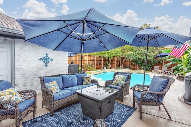 view of patio featuring an outdoor living space and a fenced in pool