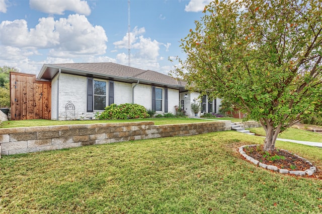 view of front of home with a front lawn