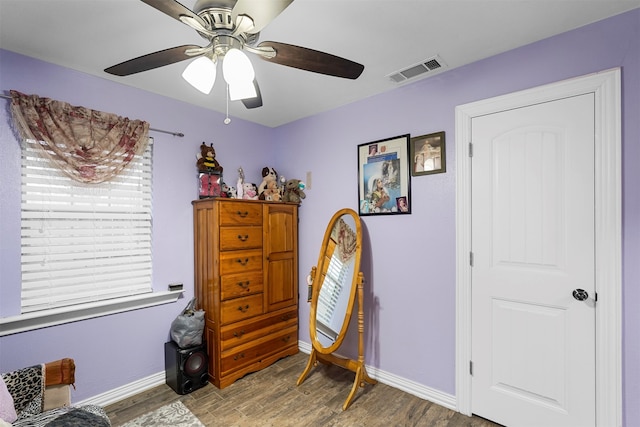 bedroom featuring hardwood / wood-style floors and ceiling fan