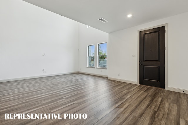 unfurnished room featuring wood-type flooring