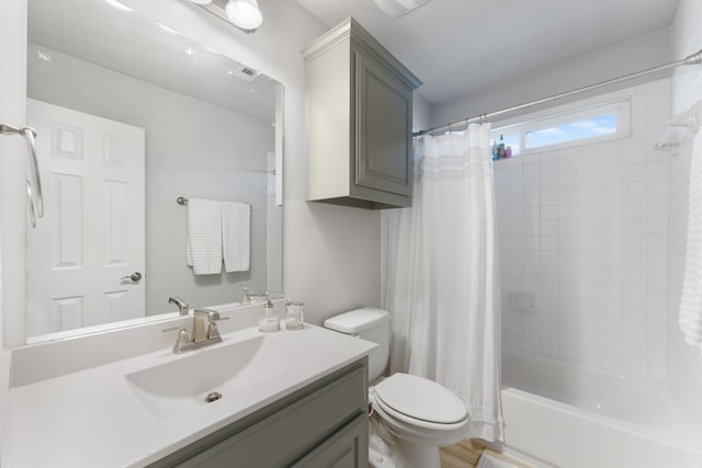 full bathroom featuring vanity, toilet, and shower / bath combo with shower curtain