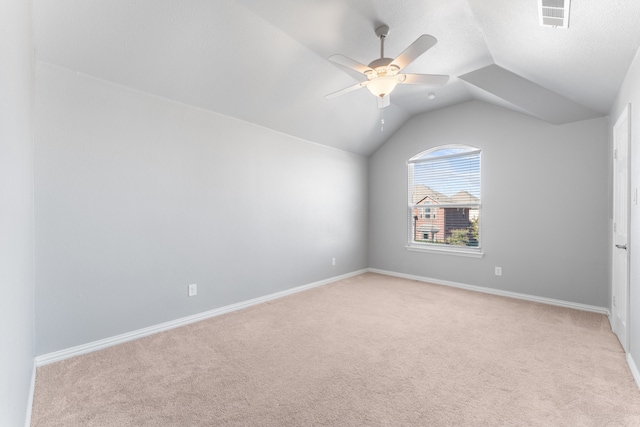 bonus room with light carpet, ceiling fan, and lofted ceiling