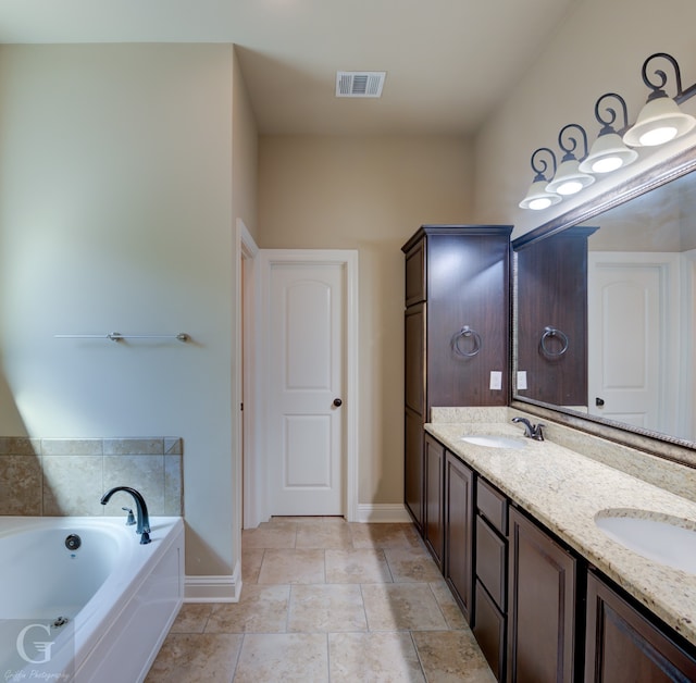 bathroom featuring a bath and vanity