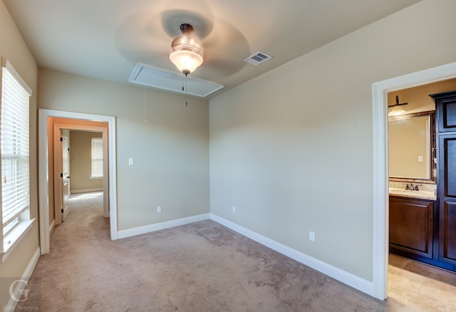 carpeted empty room featuring a wealth of natural light