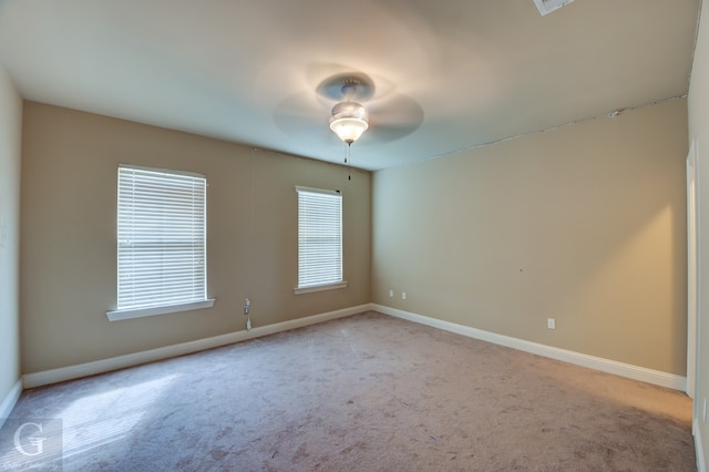 carpeted empty room with ceiling fan