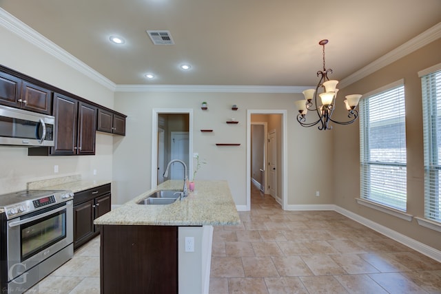 kitchen with sink, a chandelier, light stone countertops, pendant lighting, and appliances with stainless steel finishes