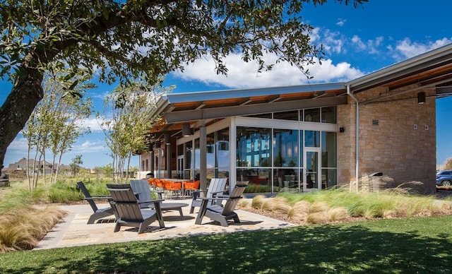 view of patio / terrace with a sunroom