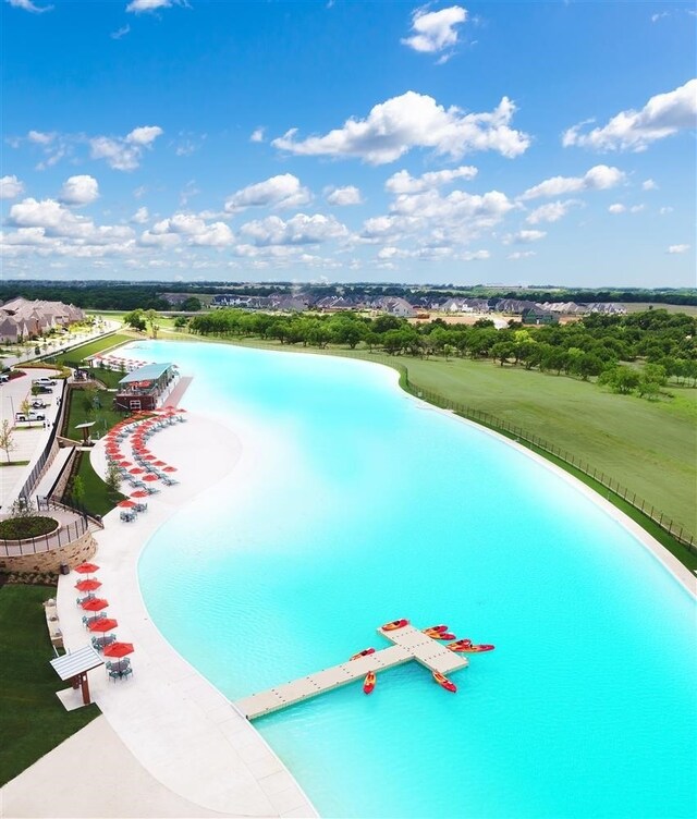 view of pool with a water view