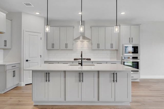 219 Briarwood Dr, Nevada, TX 75173 - kitchen featuring stainless steel oven, built in microwave, backsplash, light countertops, and recessed lighting