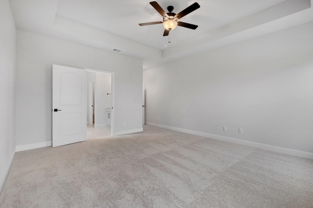 219 Briarwood Dr, Nevada, TX 75173 - unfurnished room with a ceiling fan, light colored carpet, and a tray ceiling