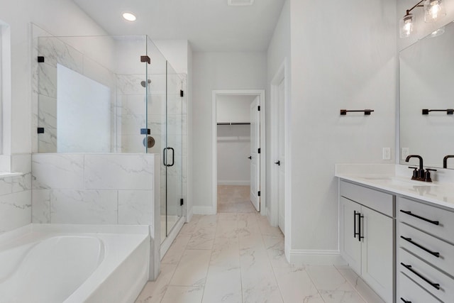 219 Briarwood Dr, Nevada, TX 75173 - bathroom with vanity, marble look tiles, a bath, a shower stall, and a walk in closet