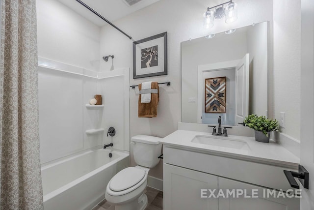 full bathroom with vanity, shower / tub combo, and toilet