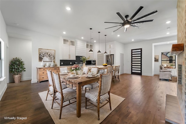 dining space with dark hardwood / wood-style floors and ceiling fan