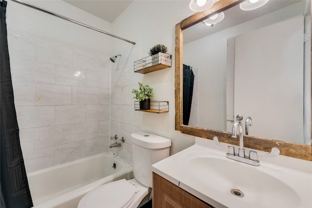 full bathroom featuring shower / bath combo with shower curtain, vanity, and toilet