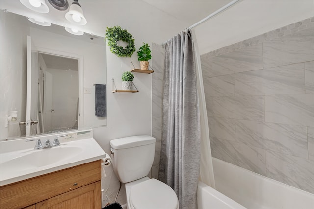 full bathroom with vanity, shower / bath combination with curtain, and toilet