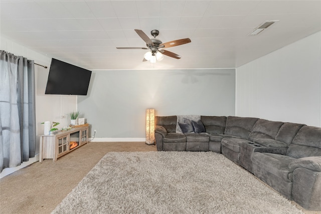 living room with light colored carpet and ceiling fan