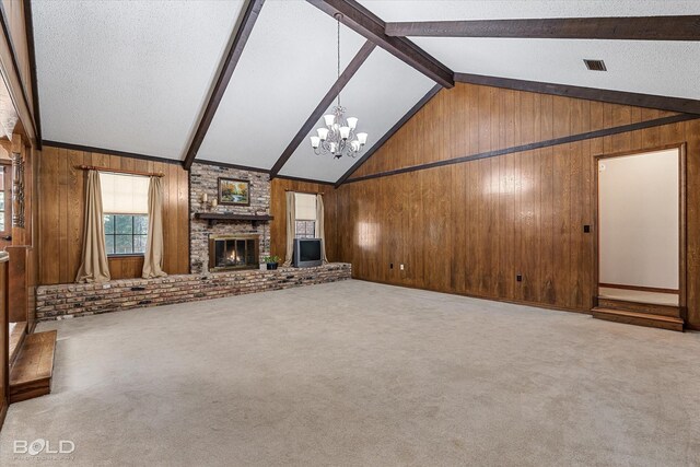 unfurnished living room featuring lofted ceiling with beams, carpet, wooden walls, and a brick fireplace