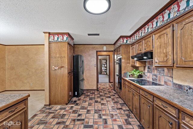 kitchen featuring backsplash, a textured ceiling, black appliances, and ornamental molding